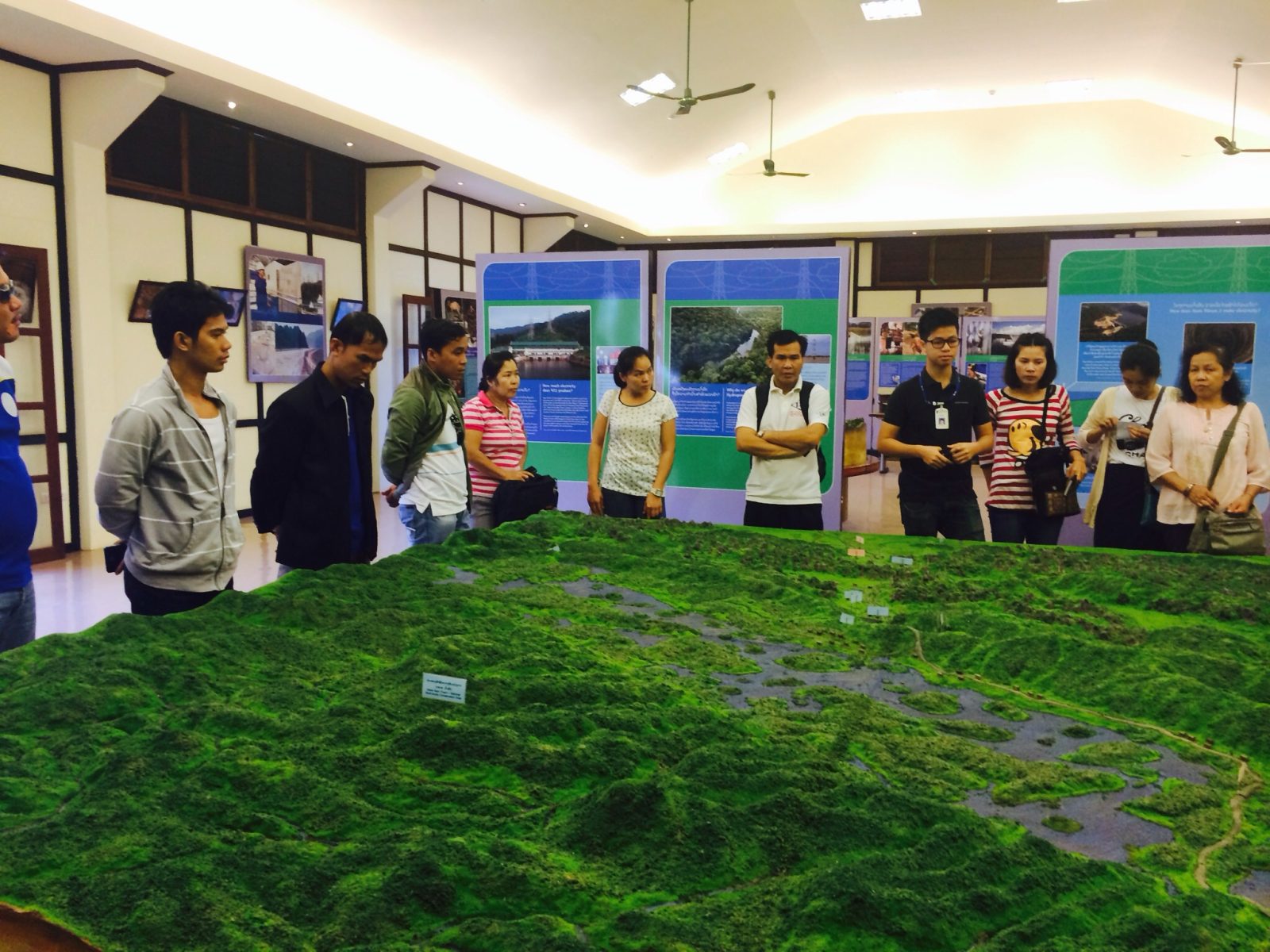 Participants look at the 3D representation of the project